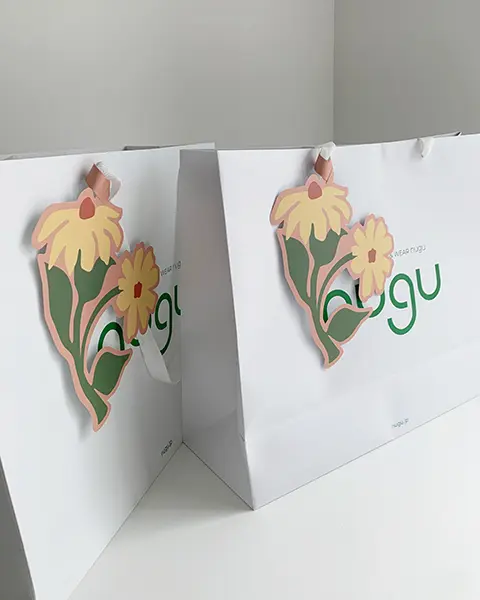 大阪にオープンする「nugu（ヌグ）ルクア店」で提供されるスペシャルショッピングバッグ