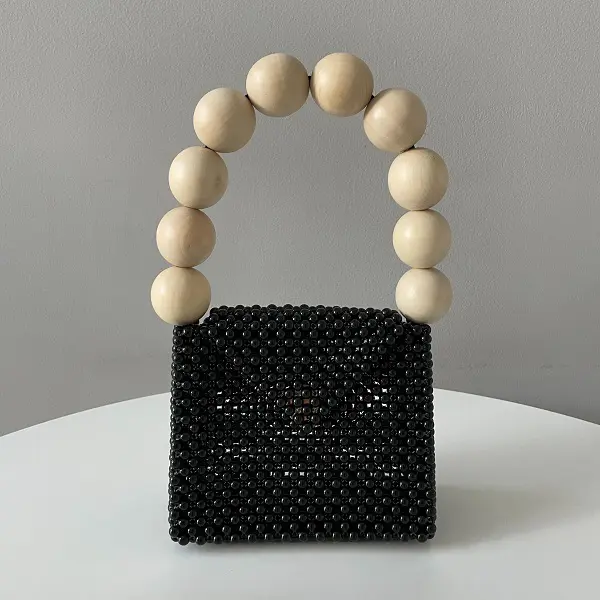 「TOOS」の「wood ball handbag」