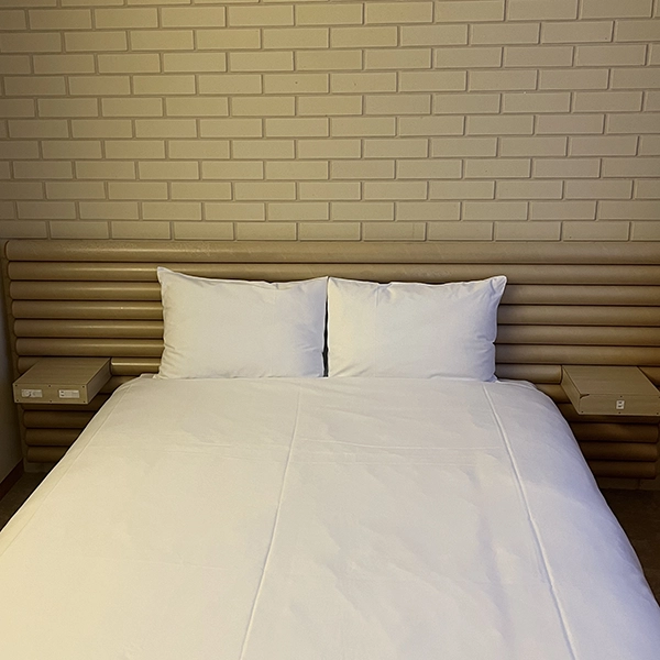 山形にある「SHONAI HOTEL SUIDEN TERRASSE」の客室のベッド