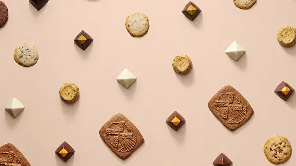 ベルギー発・老舗チョコレートブランド「NEUHAUS（ノイハウス）」2025年のラブコレクション、焼き菓子の老舗「メゾン ダンドワ」とコラボした「レ グルマンズ」シリーズのイメージ